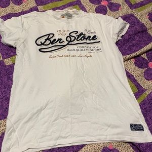 White shirt with blue writing